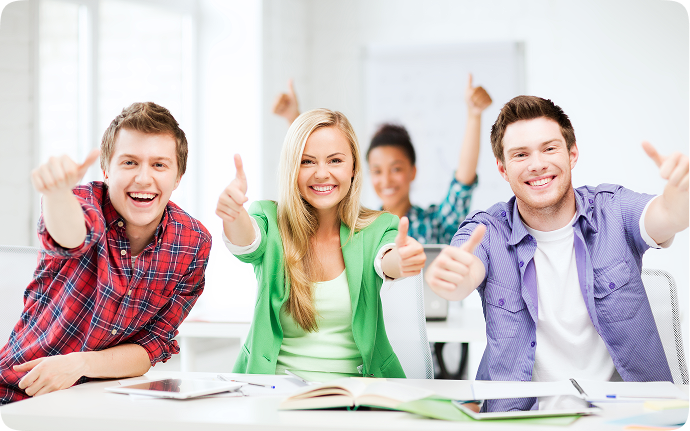 Happy students giving thumbs up
